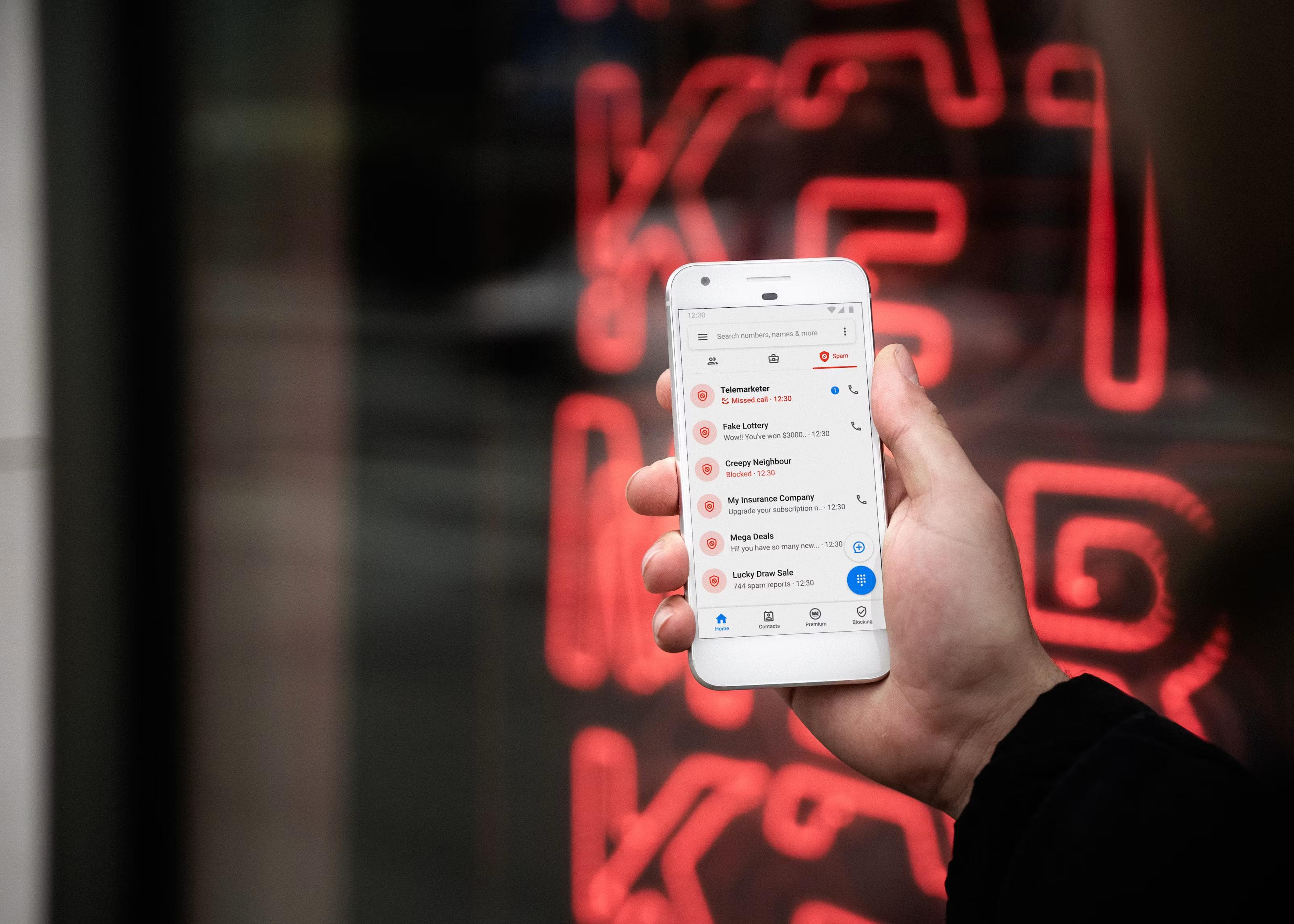 A UGC creator reviewing a suspicious brand message on a phone, illustrating scam warning signs